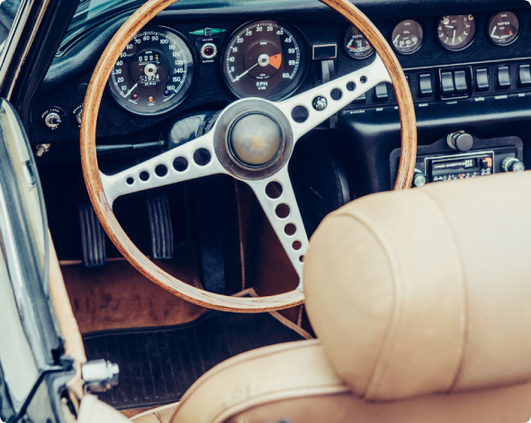 the steering wheel of a classic car